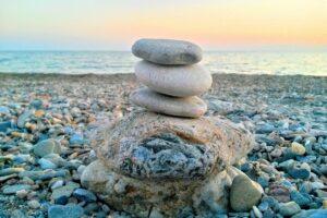 Stacked stones representing balance and alignment in Structural Integration bodywork